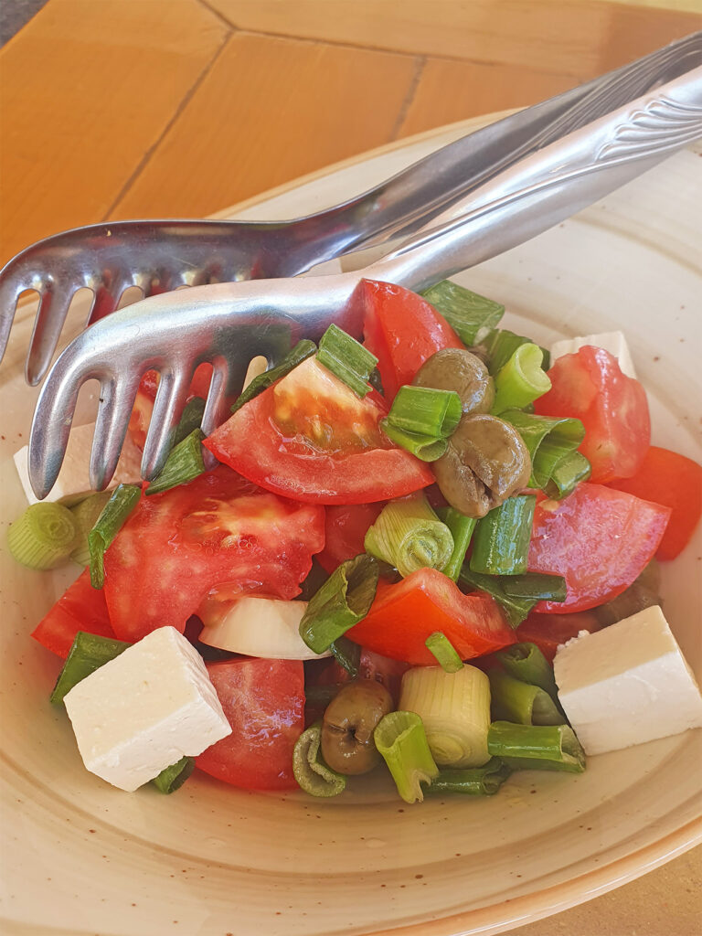 Eating a Greek Salad in Vlore, Albania on a hot summer day