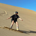 Sand surfing in Huacachina - copyrighted travel off script