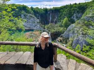 plitvice lakes photo in front of waterfall - traveloffscript