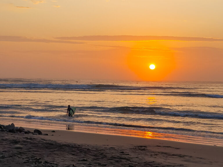 huanchaco traditional surfer sunset - traveloffscript